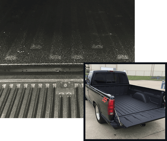 A truck bed with the liner removed and the lid opened.