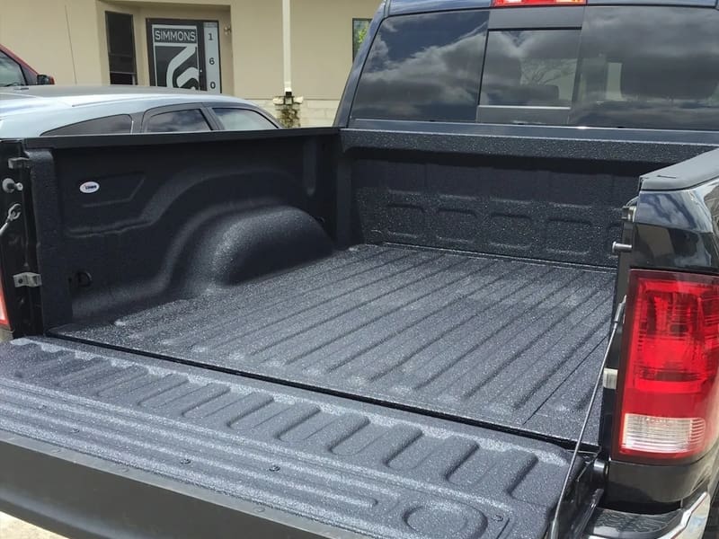 A truck bed with the lid open.