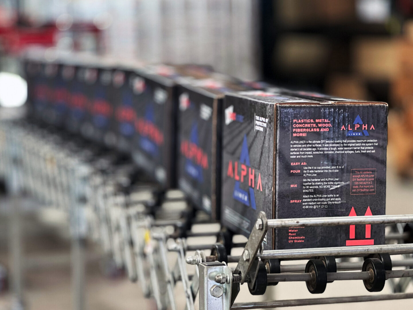 A line of boxes on the conveyer belt.