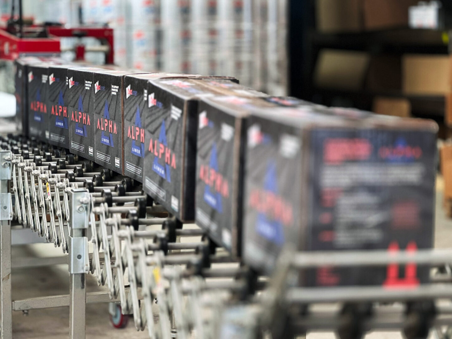 A line of boxes on the conveyer belt.